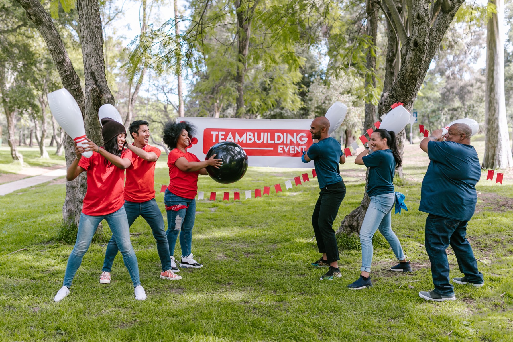 Colleagues taking part in an outdoor team building event